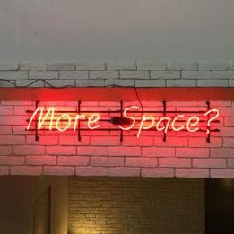 neon-sign-brick-wall
